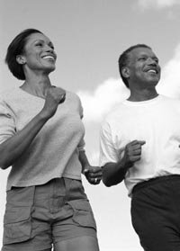 Photo of Black male and Black female jogging.