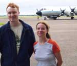 Mark Eastburn, and Ana Maria Varela pose in front of the P-3
