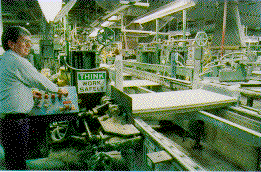Armstrong Co. photo of a man working in manufacturing.