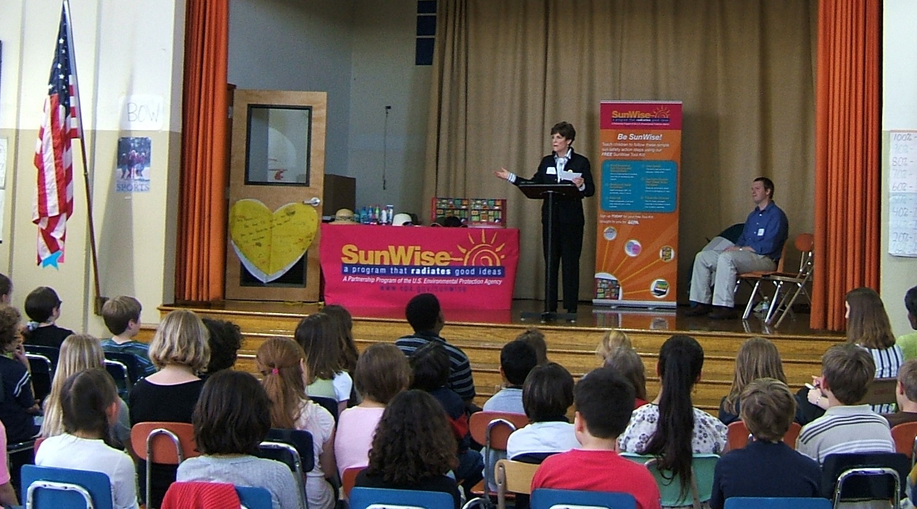Suzie Dicks of Congressional Families Action for Cancer Awareness tells students at Lowell Elementary School about the dangers of overexposure the sun.