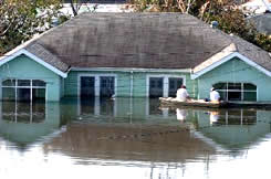 house behind flood waters