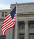 United States flag flying outside of the United States Department of Agriculture building.  [Source:  IStock International, Inc.]