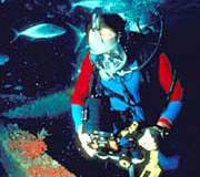A scuba diver at work with specialized equipment