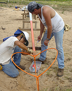 photo of men working on antenna