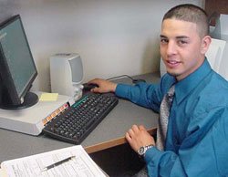 Young worker at computer.