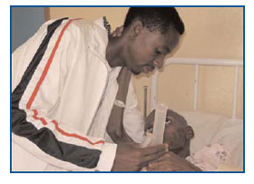 With support from PEPFAR, Sello Mokhalipi
assists a patient in the hospice ward at the
Maboloka HIV/AIDS Awareness Organization.