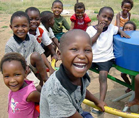 Through the power of play, children use the PlayPump water system to bring clean drinking water to their communities in sub-Saharan Africa. Photo Credit: PlayPump Water System.