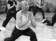 Photo of elderly woman engaging in yoga.
