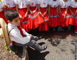 Young boy in Mexican dance costume (AP Images)