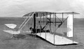 Wright brothers practice the first powered, controlled flight of a “heavier-than-air” machine 