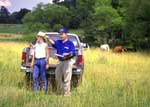 NRCS district conservationist assists a landowner (USDA photo by Bob Nichols -- click to enlarge)