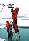 Arctic researchers repair equipment