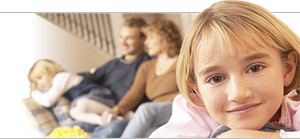 Photo of young girl in front of family.