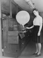 Inflating a pilot balloon Women's first opportunities in meteorology occurred as a result of WWII - Click to enlarge