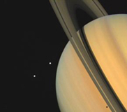 Saturn and two of its moons, Tethys (above) and Dione