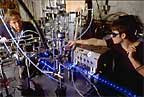  A technician in the laboratory studies chemical reactions and properties of atmospheric gases