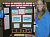 Stamatina Hunter stands beside her research poster