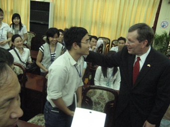 April 16, 2008 - At the conclusion of an event at the Hanoi School of Public Health U.S. Secretary of Health and Human Services Michael O. Leavitt greets a student. (Photo Credit: Christopher Hickey)