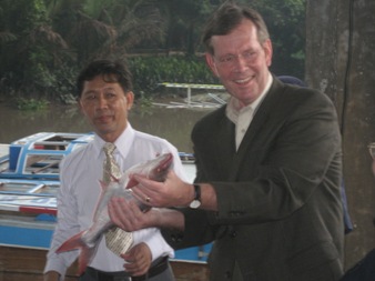 April 18, 2008 - U.S. Secretary of Health and Human Services Michael O. Leavitt holds a catfish at Faqimex Fish Processing Plant in Ben Tre Province, Viet Nam. Secretary Leavitt ended his trip to Southeast Asia on in Ben Tre-- a province with a significant aquaculture industry and a large number of traditional poultry farms-- to highlight the Secretary's dual themes of product safety and avian- and pandemic-influenza preparedness. (Photo Credit: Christopher Hickey)