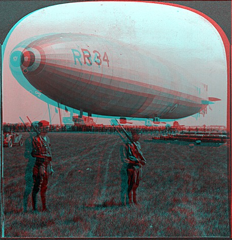 A Dirigible R-34 airship with two mariners on its side and people in the background