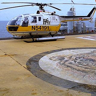 Hellicopter landing on an offshore oil platform - right next to the edge!