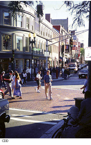 Harvard Square, with all four corners easily accessible on foot, attracts a mix of students, tourists, residents, and businesspeople, helping to meet Cambridge's goal of sustaining diverse neighborhoods and thriving commercial areas.