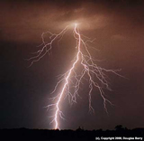 Branched lightning in brown sky