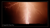 lightning in orange sky with clouds