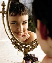 Photo of teen smiling into a mirror