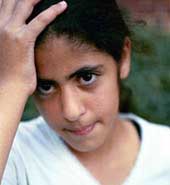 Photo of girl with her hand on her head