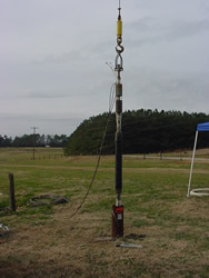 BAT3 suspended over a well (the upper packer and transducer shrouds are visible) at the Lake Wheeler Road Research Site, NC