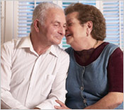 Photo of elderly couple laughing