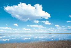 Photograph of clouds in the sky over a body of water