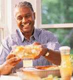 Man offering
 bowl of fruit