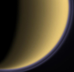 Cassini captured a purple haze encircling Titan's moon in 2004.
