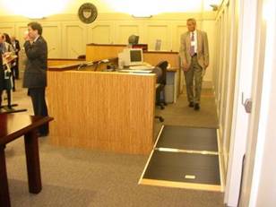 Flip-down ramp to judge's bench/ clerk's station