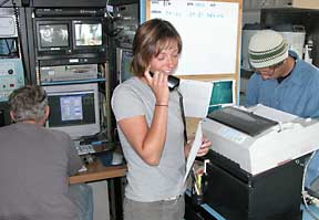 Teacher-at-Sea Carey DeLauder talks to her science students via satellite phone during the Alaska Seamount Expedition