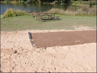 Figure 5—Termination of Soil-Sement portion of beach path. Geotextile fabric visible under completed SEWF surface. 