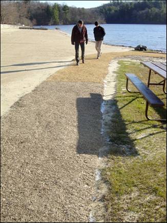 Figure 7—Beach path after 2 months of weathering. Junction of Soil-Sement and Vitri-Turf surfaces is just above the shadow cast by the picnic bench.