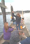 image of 2002 Students listening to hydrophone at the HMSC pier in Yaquina Bay, Newport.