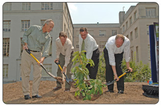 From left to right, Secretary Kempthorne, Marshal T. Case, president of the American Chestnut Foundation; Kraig Naasz, President and CEO of the National Mining Association and Brent Wahlquist, Appalachian Region Director for Interior's Office of Surface Mining Reclamation and Enforcement, at a July 26, 2007 ceremony marking the 30th anniversary of the Surface Mining Control and Reclamation Act, planted a blight-resistant American chestnut tree outside the headquarters of the Office of Surface Mining Reclamation and Enforcement in the nation's capital.
