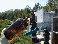 Filling a sample bottle for analysis of emerging contaminants during the National Ground-Water Reconnaissance for Emerging Contaminants Project