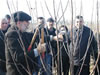 American apple expert Paul Vossen demonstrates modern pruning methods to Georgian and Ossetian farmers in an orchard near the Georgia-South Ossetia conflict zone