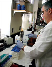 researcher using pipette