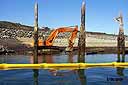 Backhoe spreads fix mix on the beach at Asarco remediation site