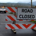Photo:  Road closed sign near flooded road