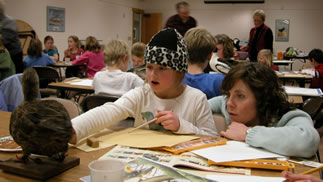 A student studies a mounted duck to prepare her Junior Duck Stamp Contest Entry. 