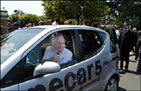 Senator Levin testing an electric car
