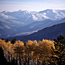 Yellow aspens and snow-capped peaks create a beautiful fall landscape photo.