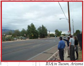 Photo of a road safety audit team observing a four-lane road at a location with a crosswalk in Tucson, Arizona.